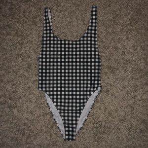 A black and white one piece swimsuit.